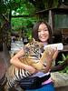 Safari World, She got to feed & play with a cub (really, how many times in your life will you be able to do that) ... not a great shot, but a shot I will print and Keep. ... Photographer Ross Hamamura, www.RDHphoto.net